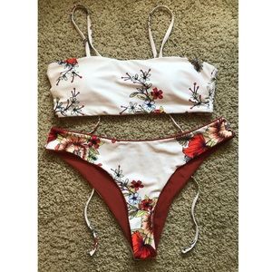 Two-piece swim suit with reversible bottoms.